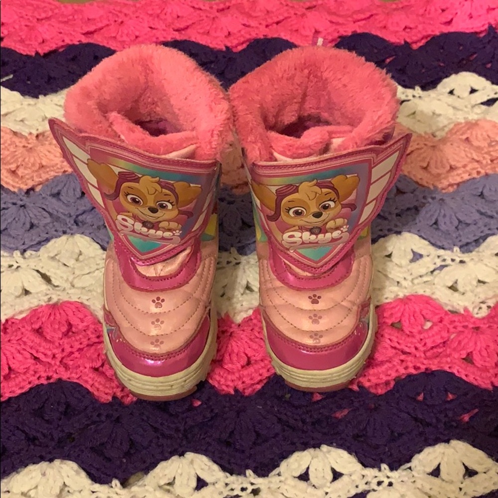 Skye from Paw Patrol pink snow boots.